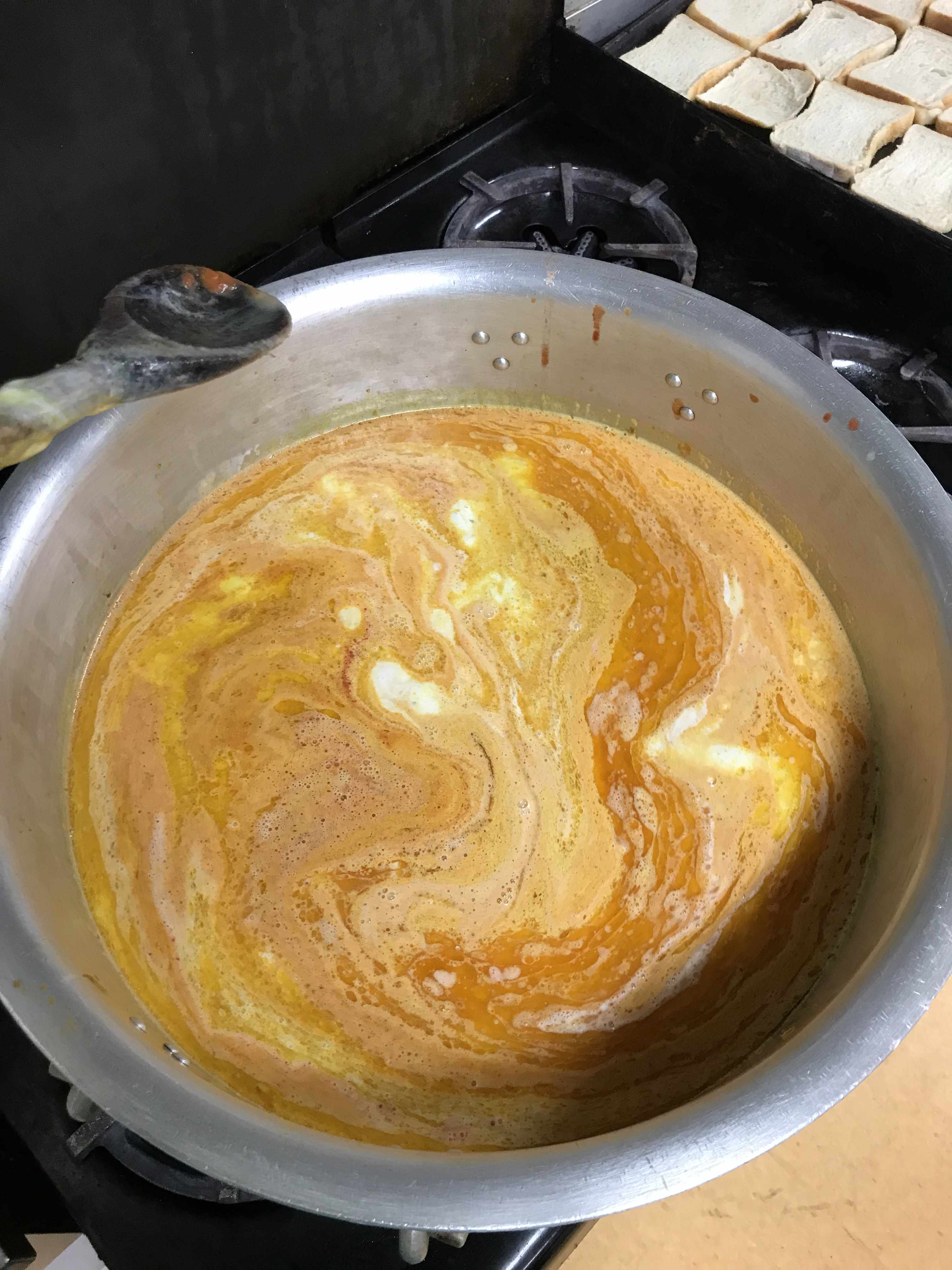 brown juices and bottom of the pan scrapings from two roasting pans of turkeys